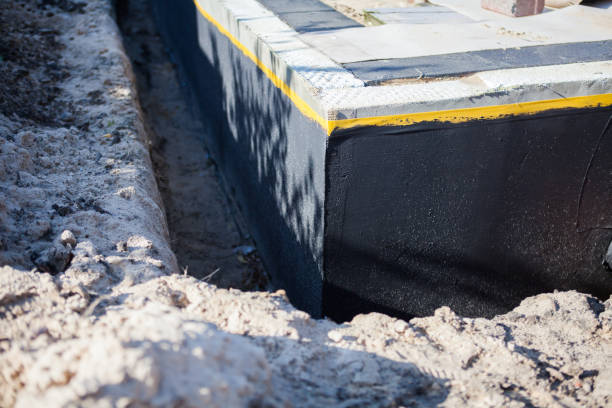 Professional Waterproofing technician working in Winn, MI